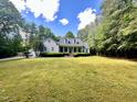 Well-maintained two-story home featuring a large front lawn and mature trees at 2934 Appaloosa Ct, Graham, NC 27253