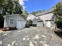 Spacious driveway leading to attached and detached garages with ample parking at 2934 Appaloosa Ct, Graham, NC 27253