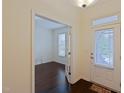 Office space with French doors, hardwood flooring, and a view to the front door at 317 Springhurst Ln, Cary, NC 27511