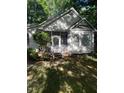 Side view of the home featuring an enclosed screened porch at 352 Riverstone Dr, Clayton, NC 27527