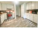 Bright kitchen features ample cabinet space, stainless steel appliances, and modern countertops at 4200 Harmony Church Rd, Efland, NC 27243