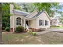 Well-maintained home with a neatly landscaped yard, brick accents, and neutral siding at 4401 Liverpool Ln, Raleigh, NC 27604