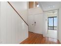 Bright foyer features hardwood floors, staircase, closet, and entry to additional room at 5073 Tall Pines Ct, Raleigh, NC 27609