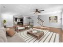 Open-concept living room features hardwood floors, a ceiling fan and bright natural light at 531 N Person St # 205, Raleigh, NC 27604