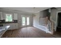 Open living area with backyard access, next to modern kitchen with great lighting at 55 Stream View Way, Spring Hope, NC 27882