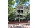Multi-level condo building featuring balconies and beautiful landscaping at 631 Springfork Dr, Cary, NC 27513