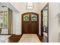 Inviting foyer with hardwood floors and a striking front door with decorative glass at 6500 Bass Mountain Rd, Snow Camp, NC 27349