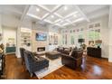 Bright and airy living room featuring coffered ceilings, a fireplace, and built-in shelving at 6500 Bass Mountain Rd, Snow Camp, NC 27349