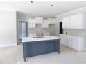 Bright kitchen with island and marble countertops, offers space and modern style at 788 Shade Tree Rd, Benson, NC 27504