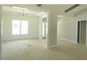 Bright living room featuring decorative molding, large window and chandelier at 788 Shade Tree Rd, Benson, NC 27504