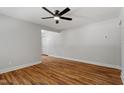 Spacious living room with hardwood floors, neutral walls and ample natural light at 833 Brigham Rd, Raleigh, NC 27610