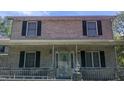 Facade of a two-story brick home with shuttered windows and decorative front door at 836 S Main St, Roxboro, NC 27573