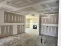 A spacious room with fireplace awaits finishing touches, promising a cozy living space at 1087 Fairhaven Dr # 48, Mebane, NC 27302