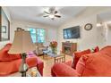 Inviting living room with hardwood floors, cozy seating, and a decorative fireplace at 109 Grange Dr, Wendell, NC 27591