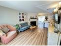 Inviting living room with fireplace, stylish furnishings, and warm, wood-look flooring at 129 Friar Ln, Carrboro, NC 27510