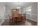 Inviting dining area with wooden furniture, hardwood floors, and natural light at 137 Campaign Dr, Mebane, NC 27302