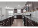 Modern kitchen boasts a large island, stainless appliances, and sleek finishes at 137 Campaign Dr, Mebane, NC 27302