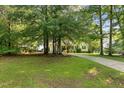 Desirable home with a long driveway and a sprawling front yard, perfect for outdoor enjoyment at 154 Jared Dr, Fuquay Varina, NC 27526