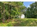 Peaceful single-Gathering home surrounded by lush greenery and mature trees on a sprawling lot at 154 Jared Dr, Fuquay Varina, NC 27526