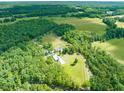 A private residence with fenced pastures, outbuildings and lush green surroundings at 1717 Ormond Rd, Hurdle Mills, NC 27541