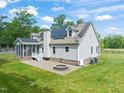 The backyard offers a firepit, a screened porch, and solar panels at 1717 Ormond Rd, Hurdle Mills, NC 27541