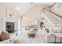 Spacious living area with vaulted ceilings, fireplace, and lots of natural light at 1717 Ormond Rd, Hurdle Mills, NC 27541