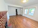 Bright living room boasting hardwood floors, fireplace, and natural light streaming through the windows at 2309 Chautauqua Ave, Durham, NC 27707
