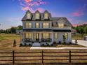Stunning two-story home with a classic design, complemented by a neatly landscaped yard and inviting curb appeal at 2371 Old Us 421, Lillington, NC 27546