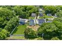 Aerial view of a home nestled among lush greenery, showcasing its peaceful neighborhood setting at 2521 Newbold St, Raleigh, NC 27603
