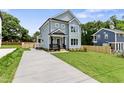 Inviting two-story home with a spacious driveway and well-maintained lawn, perfect for families at 2521 Newbold St, Raleigh, NC 27603