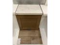 Close up of kitchen brown cabinetry with light veined countertop and light wood flooring at 355 Chesapeake Cmns St # 112, Garner, NC 27529
