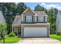 Charming two-story home with a two-car garage and well-maintained landscaping at 4009 Patriot Ridge Ct, Raleigh, NC 27610