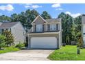 Charming two-story home with a two-car garage and well-maintained landscaping at 4009 Patriot Ridge Ct, Raleigh, NC 27610