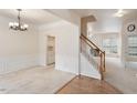 Formal dining room with wainscoting, chandelier, and a built-in cabinet at 402 Halls Mill Dr, Cary, NC 27519