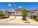 Attractive townhomes with varied architectural designs, complemented by lush green trees and well-kept lawns at 512 Barneswyck Dr, Fuquay Varina, NC 27526