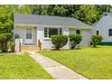 Attractive single-story home with a neat front yard and a walkway leading to the entrance at 605 E Montgomery St, Henderson, NC 27536