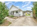 Well-kept home featuring a side carport and landscaped front yard for a blend of convenience and charm at 606 Arden St, Burlington, NC 27215