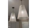 Elegant glass pendant lights with a unique cone shape and woven pattern, adding a touch of sophistication at 987 Lewis Rd, Zebulon, NC 27597