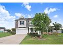 Well-maintained two-story home with a two car garage, lush lawn, and a charming front porch at 104 Bollienger Dr, Princeton, NC 27569