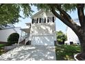 Charming two-story home with a two-car garage, well-maintained lawn and beautiful tree at 109 Troyer Pl, Apex, NC 27502