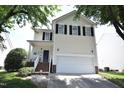 Two-story home features a white garage door and black shutters against light siding under a bright, sunny sky at 109 Troyer Pl, Apex, NC 27502