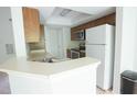 Functional kitchen with stainless steel appliances and plenty of counter space at 115 Abingdon Ct # 2B, Cary, NC 27513