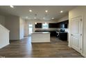 Open kitchen featuring granite counters, stainless appliances, island, and dark cabinetry at 136 Bruce Dr Dr, Dunn, NC 28334