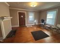 Bright living room with hardwood floors and decorative fireplace at 1704 Southgate St, Durham, NC 27703