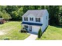Well-maintained two-story home with gray siding, black shutters, and lush green lawn at 194 Catskill Ct, Burlington, NC 27217