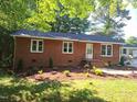 Charming brick home featuring a landscaped yard, enhancing its curb appeal at 2085 Enon Rd, Oxford, NC 27565