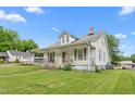 Charming home with a well-maintained lawn and classic architecture, capturing a serene suburban setting at 219 W Parker St, Graham, NC 27253