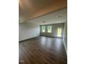 Bright open-concept living area features neutral paint and wood-look flooring at 224 Wild Turkey Way, Lillington, NC 27546