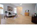 Spacious living room with light-filled windows and a cozy seating arrangement at 3021 Remington Oaks Cir, Cary, NC 27519