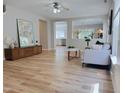 Open concept living room featuring wood floors and lots of natural light at 3021 Remington Oaks Cir, Cary, NC 27519